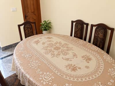 Wooden dinning table with six chairs