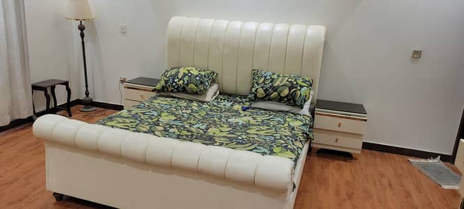 king size off white leather bed