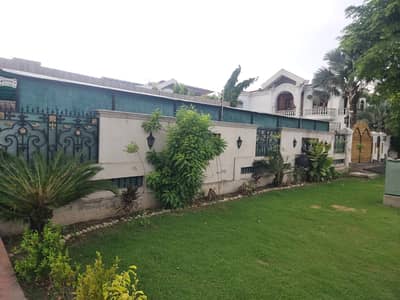 One Kanal Lawn + One Kanal Slightly Used Spanish Design Most Beautiful Bungalow For Sale At Prime Location Of DHA Lahore Near To DHA Lahore Near To Park Masjid & Commercial Market.
