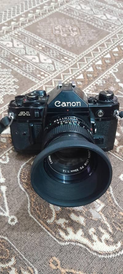 canon A-1 with manual 2 lenses