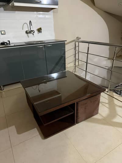 Coffee Table with pull out stools in good Condition