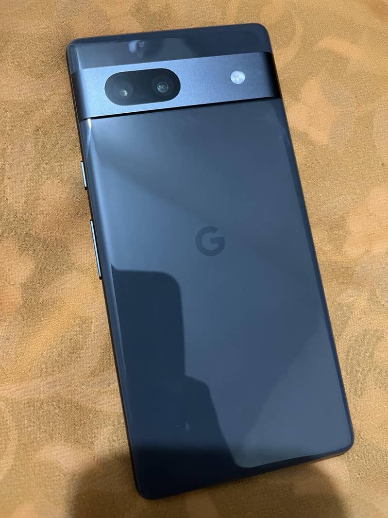 Google Pixel 7a with it's charger 1