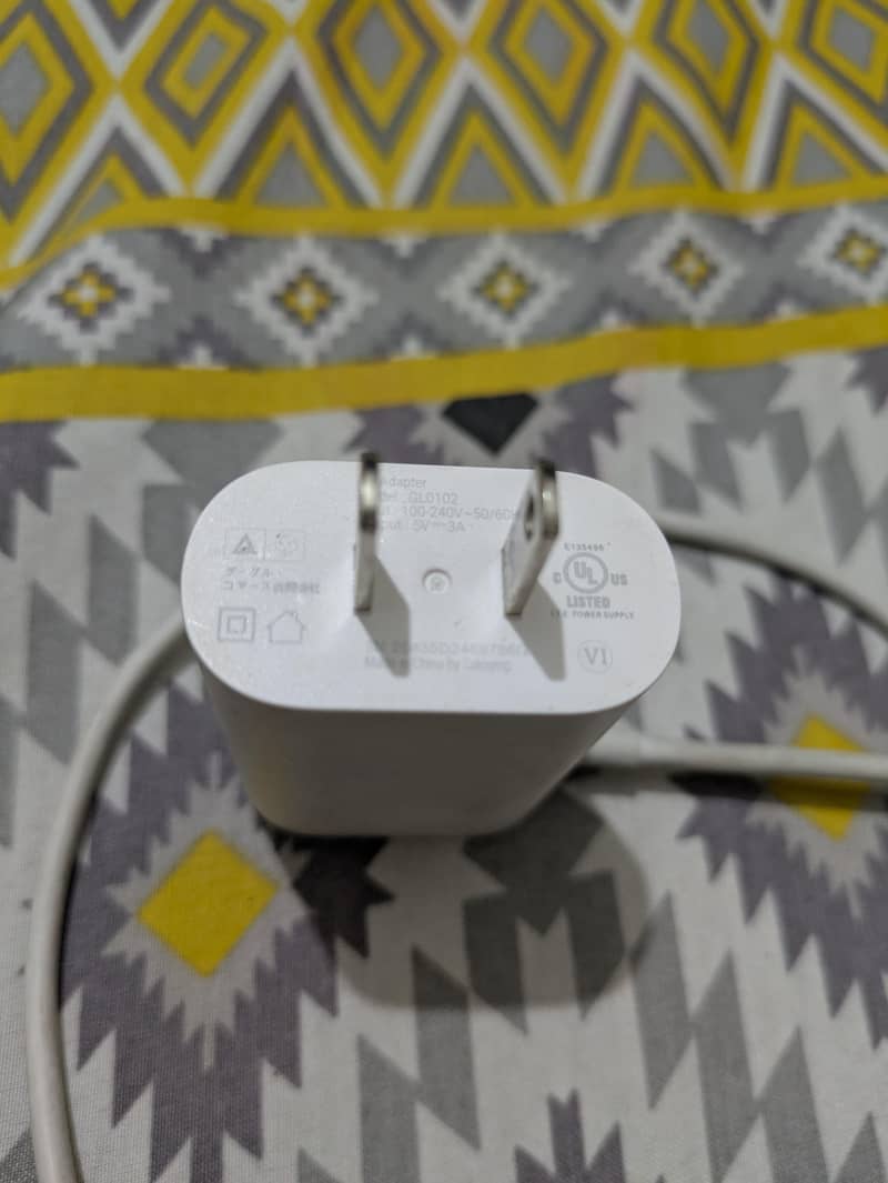 Google Pixel 7a with it's charger 2
