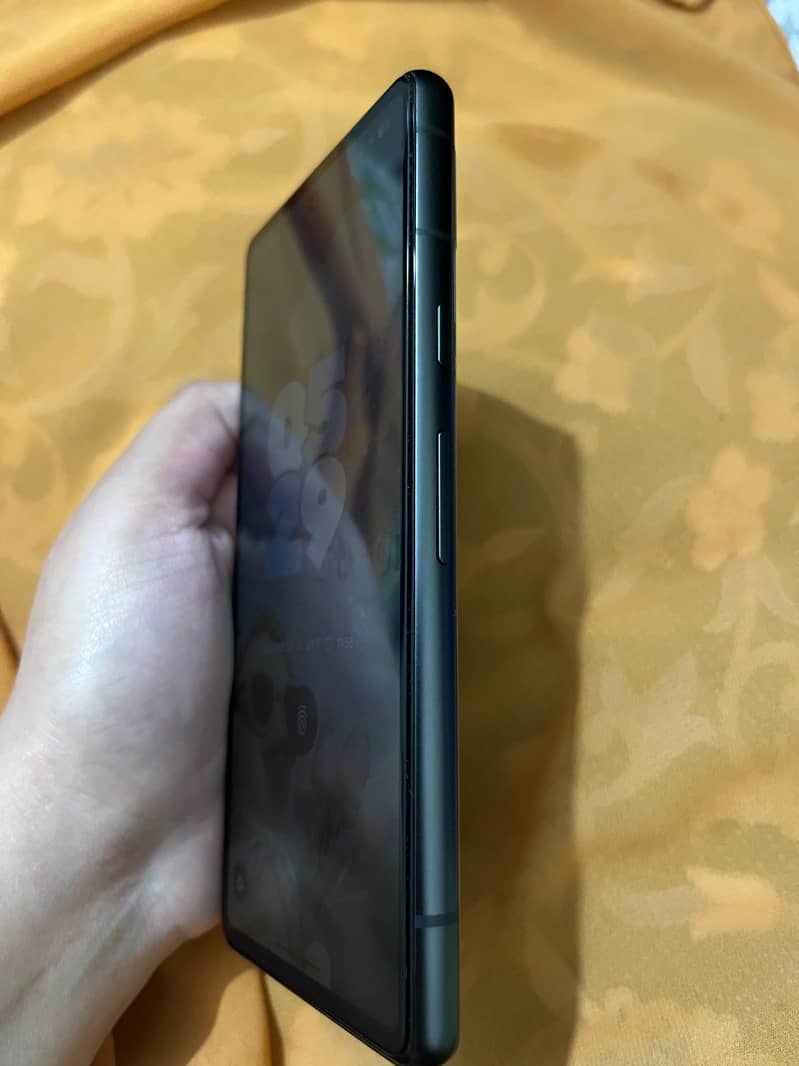 Google Pixel 7a with it's charger 3