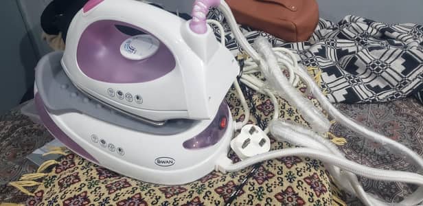 brand. . . (Swan) steam iron