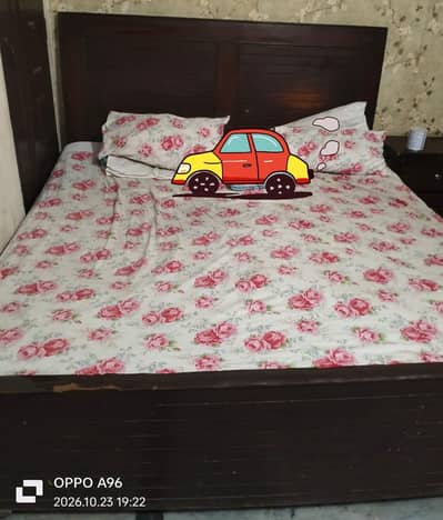 used wooden bed