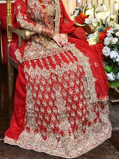 heavy red bridal lehenga 4 PCs with potli