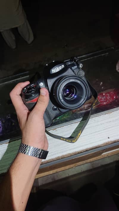 Nikon D200 with 50mm f1.8 (read full ad)