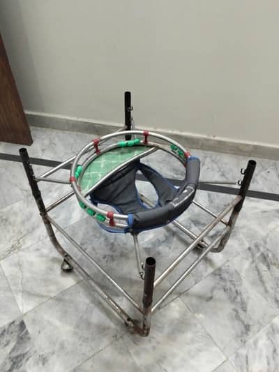 2 Baby Walkers - 1 Steel 1 Plastic