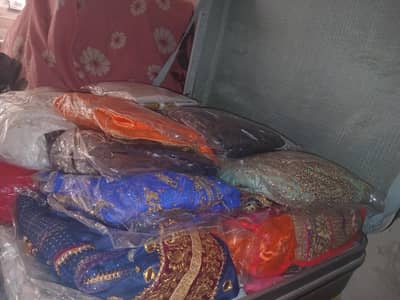 selling trunk with full of fancy clothes of different fabrics
