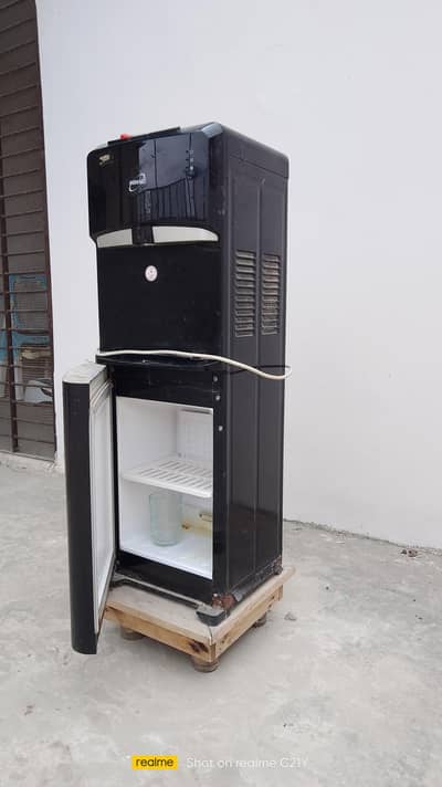 In working condition with wooden base