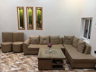 l shape sofas 9 seater. 1 table. .