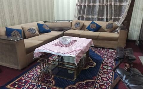Golden color, L shaped sofa in perfect condition. comes with covers