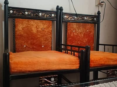 Used Iron Frame Sofa with Orange Cushions – Good Design