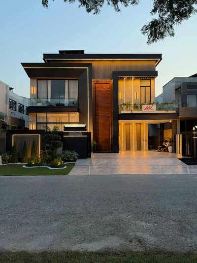 1 KANAL ELEGANT AND FULLY FURNISHED BUNGALOW WITH FULL BASEMENT, CINEMA, POOL, LIFT, ROOF & SOLAR TOP IS AVAILABLE IN THE BEST BLOCK OF DHA LAHORE.