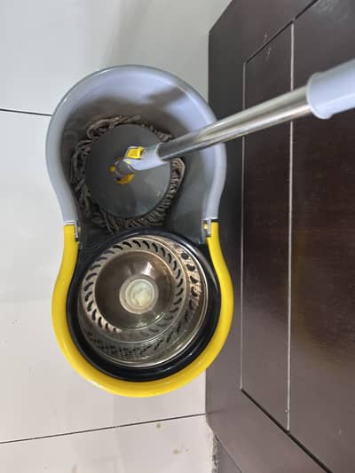 Selling a slightly used spin mop with bucket, purchased from Dubai.