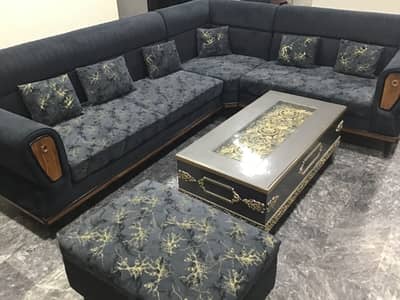 L shaped 8. Seater sofa with puffy
