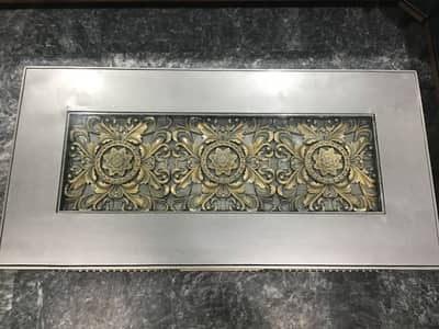 A classic & beautiful table with mid glass