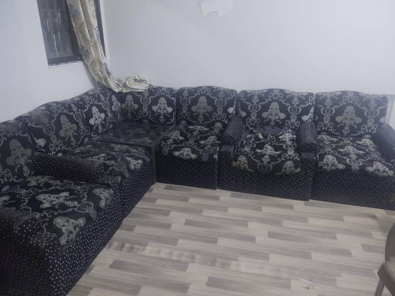 Black L-shapped sofas 5
