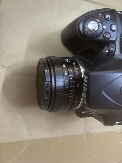 Nikon D3300 with 18-55 and 50m lens. Battery charger and cables.