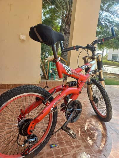 Double red and silver dual-suspension mountain bicycle