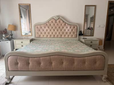 king size bed in deco with two side table and dressing
