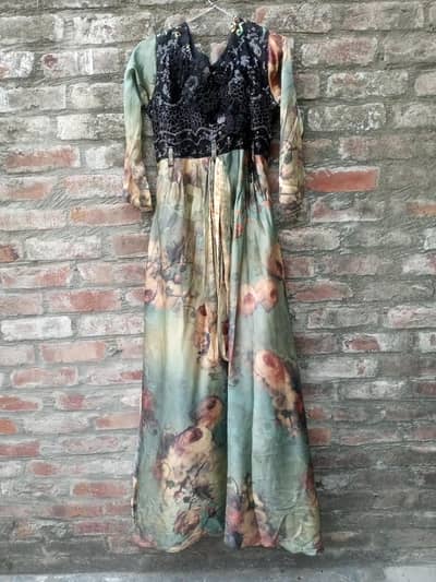 Elegant sage green floral maxi dress with black embroidery bodice
