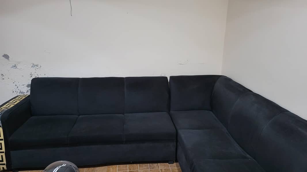 L shape Black colour sofa. 0