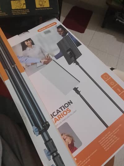 ITS A SQUARE LIGHT WITH STAND OWN WITH TRIPOD STAND