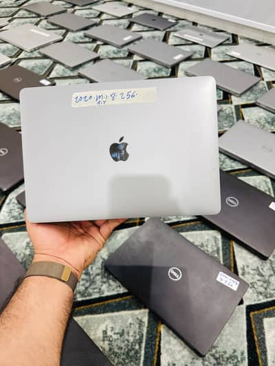 Apple MacBook Air M1 (2020)  Specifications:  * Apple M1 Chip * 8GB