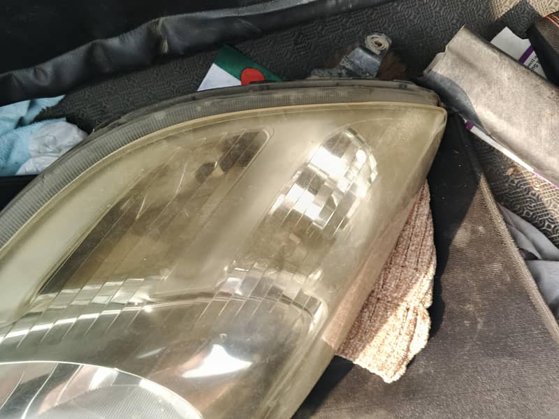 vitz 2008 headlight left side 2