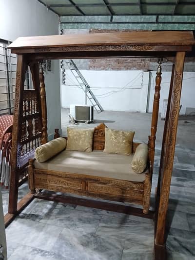 wooden swing  (jhula)
