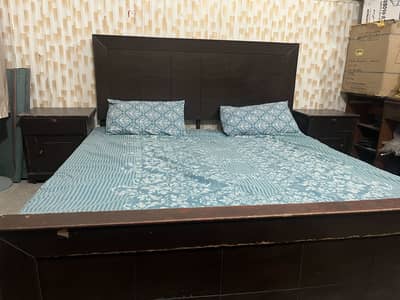 Double bed with mattress and side tables