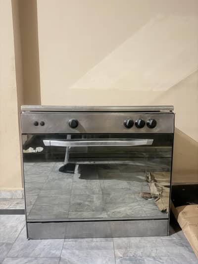 3-Burner Stainless Steel Cooking Range with Oven – Rs. 20,000