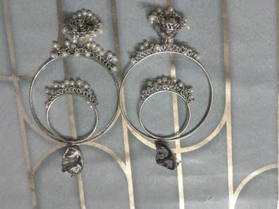 Long earrings.