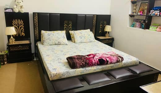 king size bed with side table dressing and cubourd and showcase