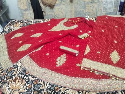 Red bridal heavy embroidered shirt with dupatta & matching clutch