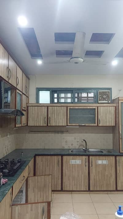 *Gulshan-e-Iqbal Block 4 - Portion for Rent*  - *Location:* Block 4, Gulshan-e-Iqbal - *Floor:* First Floor (1st Floor) - *Size:* 3 Bed with Drawing / Dining (3 Bed DD) - *Washrooms:* 2 Attached Washroom - *Flooring:* Tiles Flooring - *Condition:* Owner Built, Well Maintained Kitchen, Wardrobes bane hue hain - *Extra:* Big Terrace + Separate Entrance - *Rent:* 150,000 PKR - Negotiable 300 square yards  *Code(16973)*