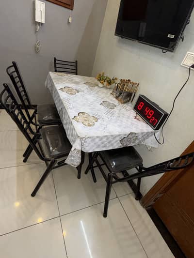 Dinning table condition is good chairs are almost new
