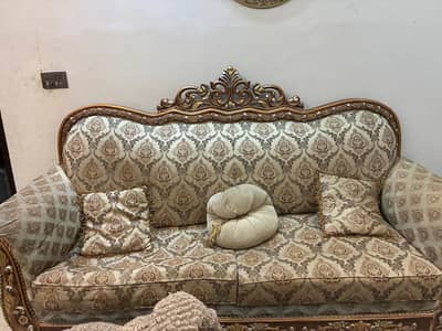 Used 7 seater sofa set along with 2 royal chairs and a center table