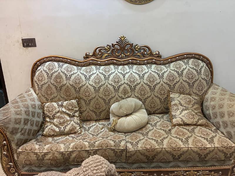 Used 7 seater sofa set along with 2 royal chairs and a center table ...