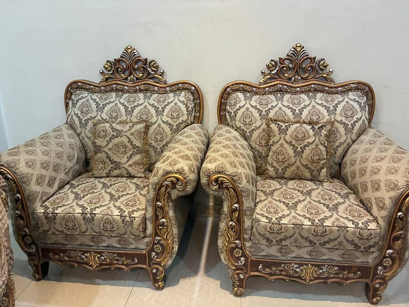 Used 7 seater sofa set along with 2 royal chairs and a center table ...