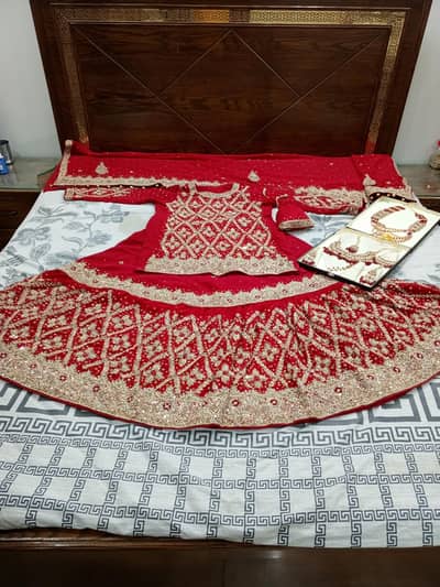 heavy bridal Red Lehnga with complete jewelry Set