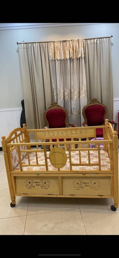 Baby cot by Happy Baby available for sale.