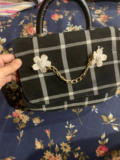 White and black hand carry and shoulder bag