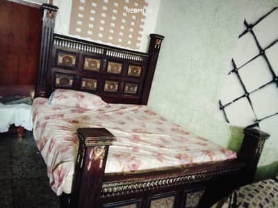 Wooden double bed for sale with spring matress -Brass work - used