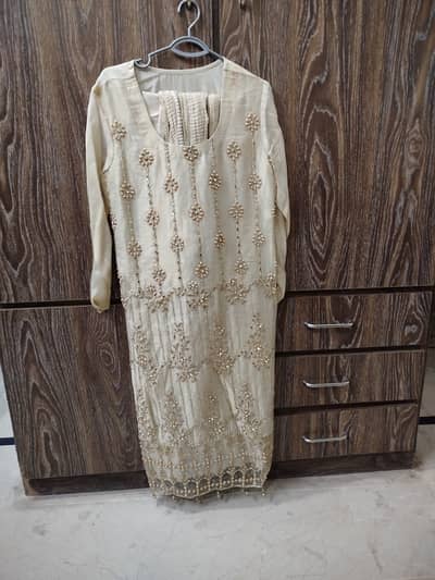 Golden colour net shirt , trousers and dupatta