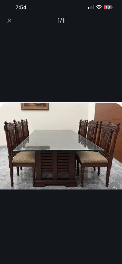 Pure wood dinning table with 8 cushioned chairs in excellent condition