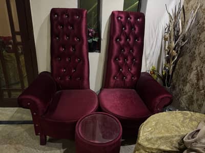 Two sofa chairs with one table