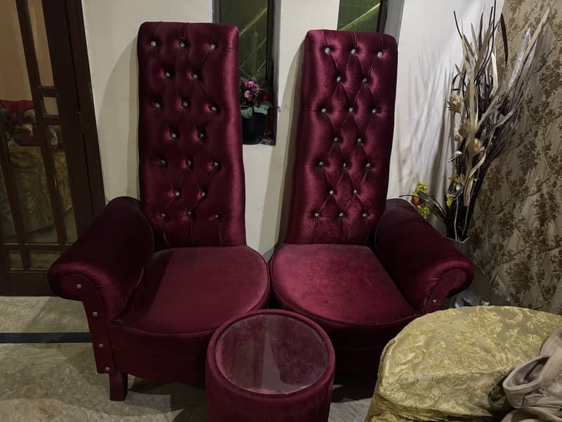 Two sofa chairs with one table 0